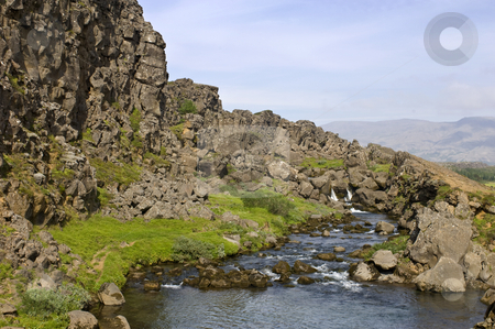 To use this stock image in your creative project, please select the size you need over to the right and click the "Add to Cart" button.
Your downloaded image will come with the Cutcaster watermark removed so don’t worry about the watermark you see on this page. Thingvellir stock photo, The Oxara River in the Thingvellir national park by Corepics VOF