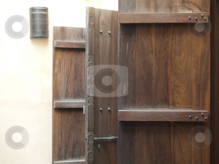 To use this stock image in your creative project, please select the size you need over to the right and click the "Add to Cart" button.
Your downloaded image will come with the Cutcaster watermark removed so don’t worry about the watermark you see on this page. Door 01 stock photo, Three open doors made out of dark wood by Jose .