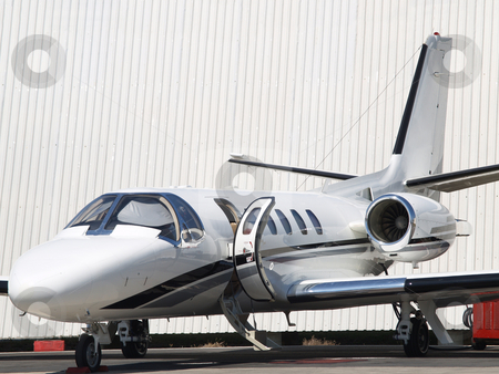 To use this stock image in your creative project, please select the size you need over to the right and click the "Add to Cart" button.
Your downloaded image will come with the Cutcaster watermark removed so don’t worry about the watermark you see on this page. Private jet 01 stock photo, Private jet stationed with opened hatch by Jose .