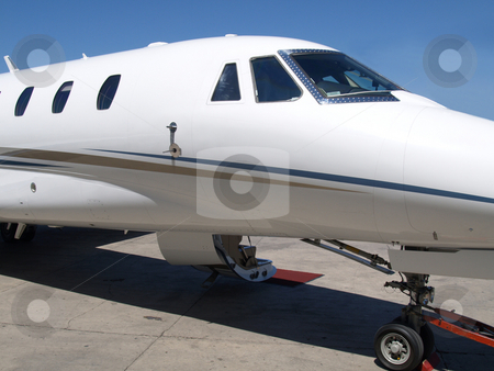 To use this stock image in your creative project, please select the size you need over to the right and click the "Add to Cart" button.
Your downloaded image will come with the Cutcaster watermark removed so don’t worry about the watermark you see on this page. Private Jet 03 stock photo, Front view of a private jet by Jose .