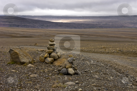 To use this stock image in your creative project, please select the size you need over to the right and click the "Add to Cart" button.
Your downloaded image will come with the Cutcaster watermark removed so don’t worry about the watermark you see on this page. Icelandic Tundra stock photo, The barren emptiness of the Icelandic Highlands, with a varda, symbolising the custom for a safe onward journey by Corepics VOF