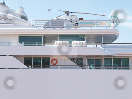 To use this stock image in your creative project, please select the size you need over to the right and click the "Add to Cart" button.
Your downloaded image will come with the Cutcaster watermark removed so don’t worry about the watermark you see on this page. Yacht 04 stock photo, Helicopter sitting on the deck of a private yacht by Jose .