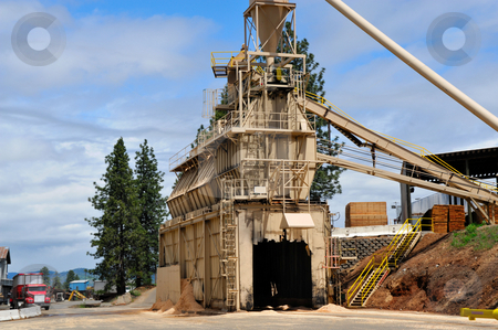 To use this stock image in your creative project, please select the size you need over to the right and click the "Add to Cart" button.
Your downloaded image will come with the Cutcaster watermark removed so don’t worry about the watermark you see on this page. Lumber Mill stock photo, Saw dust loading terminal. Loads trucks with milling by-products that is then recycled into other products made of wood by Lynn Bendickson