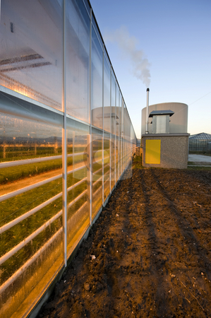 To use this stock image in your creative project, please select the size you need over to the right and click the "Add to Cart" button.
Your downloaded image will come with the Cutcaster watermark removed so don’t worry about the watermark you see on this page. Glasshouse stock photo, The exterior glass fascade of a huge glasshouse with heating system and generator by Corepics VOF