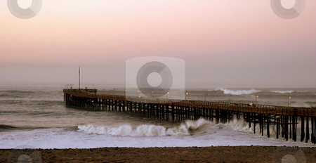To use this stock image in your creative project, please select the size you need over to the right and click the "Add to Cart" button.
Your downloaded image will come with the Cutcaster watermark removed so don’t worry about the watermark you see on this page. Ocean Wave Storm Pier stock photo, Ocean waves throughout at storm crashing into a wooden pier. by Henrik Lehnerer