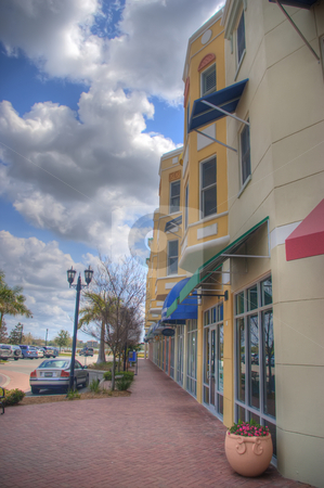 To use this stock image in your creative project, please select the size you need over to the right and click the "Add to Cart" button.
Your downloaded image will come with the Cutcaster watermark removed so don’t worry about the watermark you see on this page. Main Street Shops stock photo, Main Street shops in small Florida town. by Steve Carroll