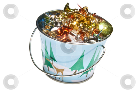 To use this stock image in your creative project, please select the size you need over to the right and click the "Add to Cart" button.
Your downloaded image will come with the Cutcaster watermark removed so don’t worry about the watermark you see on this page. Miniture Holiday Bucket Filled with Brightly Colored Push-Pins, stock photo, Miniture bucket with Holiday design, filled with brightly colored push pins. Isolated on a white background. by Steve Carroll