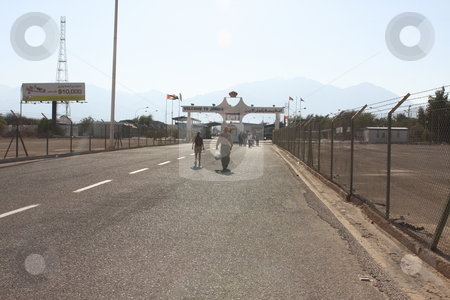 To use this stock image in your creative project, please select the size you need over to the right and click the "Add to Cart" button.
Your downloaded image will come with the Cutcaster watermark removed so don’t worry about the watermark you see on this page. Israel Jordan border crossing stock photo, Entering Jordan at the Wadi Araba border crossing by Chris Budd
