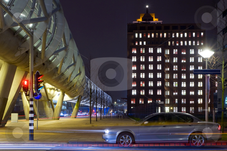 To use this stock image in your creative project, please select the size you need over to the right and click the "Add to Cart" button.
Your downloaded image will come with the Cutcaster watermark removed so don’t worry about the watermark you see on this page. Night Traffic stock photo, A car accellerating when the traffic lights jumps to green in a business district with futuristic, modern buildings and an elevaated tram tube by Corepics VOF