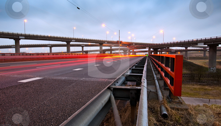 To use this stock image in your creative project, please select the size you need over to the right and click the "Add to Cart" button.
Your downloaded image will come with the Cutcaster watermark removed so don’t worry about the watermark you see on this page. Highway Overpass stock photo, A highway overpass with busy traffic at night. Various roads intertwining with each other by Corepics VOF
