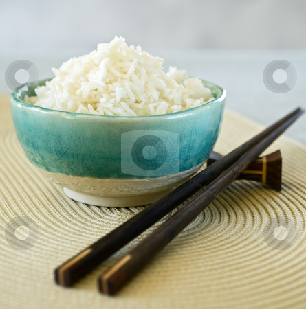 To use this stock image in your creative project, please select the size you need over to the right and click the "Add to Cart" button.
Your downloaded image will come with the Cutcaster watermark removed so don’t worry about the watermark you see on this page. Rice bowl stock photo, Ceramic bowl with plain white rice by Noam Armonn