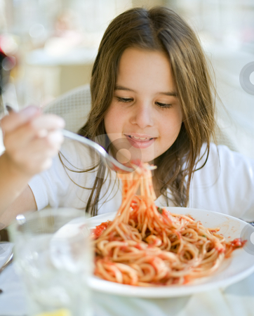 To use this stock image in your creative project, please select the size you need over to the right and click the "Add to Cart" button.
Your downloaded image will come with the Cutcaster watermark removed so don’t worry about the watermark you see on this page. Child having spaghetti stock photo, Young girl eating spaghetti in restaurent by Noam Armonn