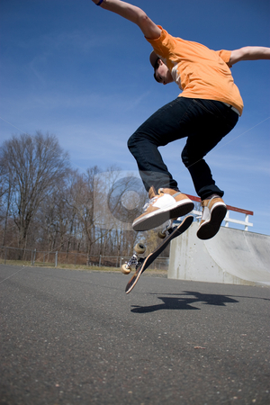 To use this stock image in your creative project, please select the size you need over to the right and click the "Add to Cart" button.
Your downloaded image will come with the Cutcaster watermark removed so don’t worry about the watermark you see on this page. Skateboarder Jumping stock photo, Portrait of a young skateboarder performing a trick at the skate park. by Todd Arena