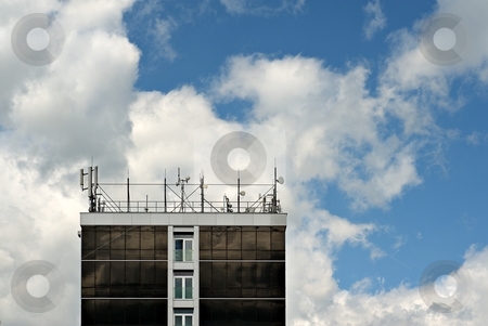 To use this stock image in your creative project, please select the size you need over to the right and click the "Add to Cart" button.
Your downloaded image will come with the Cutcaster watermark removed so don’t worry about the watermark you see on this page. Antennas on roof stock photo, Roof of a building filled with antennas and communication devices. by Juraj Kovacik