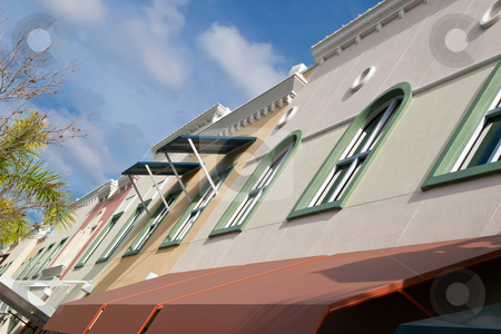 To use this stock image in your creative project, please select the size you need over to the right and click the "Add to Cart" button.
Your downloaded image will come with the Cutcaster watermark removed so don’t worry about the watermark you see on this page. Artsy-fartsy line of windows stock photo, Line of windows of Condos above downtown businesses on Mainstreet, Lakewood Ranch, Florida by Steve Carroll