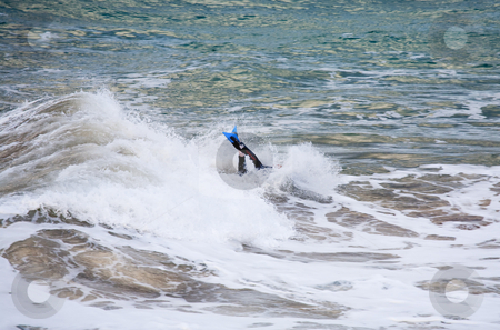 To use this stock image in your creative project, please select the size you need over to the right and click the "Add to Cart" button.
Your downloaded image will come with the Cutcaster watermark removed so don’t worry about the watermark you see on this page. Face Plant stock photo, A young man on a Boogie Board getting a face plant from an unexpected wave by Mike Dawson