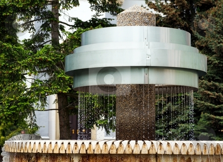 To use this stock image in your creative project, please select the size you need over to the right and click the "Add to Cart" button.
Your downloaded image will come with the Cutcaster watermark removed so don’t worry about the watermark you see on this page. Metal fountain stock photo, Metal fountain with water in a park by Juraj Kovacik