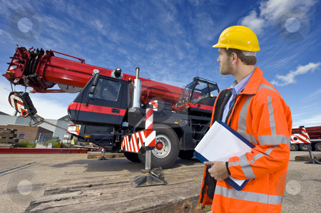 To use this stock image in your creative project, please select the size you need over to the right and click the "Add to Cart" button.
Your downloaded image will come with the Cutcaster watermark removed so don’t worry about the watermark you see on this page. Maintenance engineer stock photo, A maintenance engineer overlooking a huge mobile crane, the object of his inspection by Corepics VOF