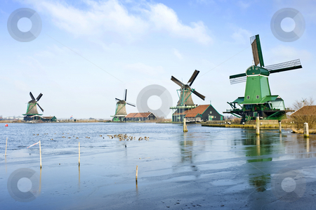 To use this stock image in your creative project, please select the size you need over to the right and click the "Add to Cart" button.
Your downloaded image will come with the Cutcaster watermark removed so don’t worry about the watermark you see on this page. Four windmills stock photo, Four typically Dutch windmills in De Zaanse Schans near de river Zaan in the Netherlands by Corepics VOF