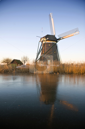 To use this stock image in your creative project, please select the size you need over to the right and click the "Add to Cart" button.
Your downloaded image will come with the Cutcaster watermark removed so don’t worry about the watermark you see on this page. Windmill in the Morning Light stock photo, A typical Dutch windmill basking in the warm glow of the winter morning light by Corepics VOF