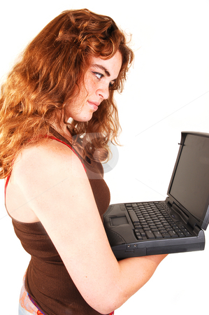 To use this stock image in your creative project, please select the size you need over to the right and click the "Add to Cart" button.
Your downloaded image will come with the Cutcaster watermark removed so don’t worry about the watermark you see on this page. Schoolgirl with laptop. stock photo, A young red haired schoolgirl in her uniform lying on the floor with the
laptop and thinking about her homework. by Horst Petzold
