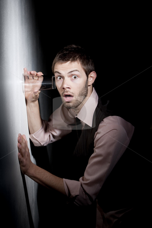 To use this stock image in your creative project, please select the size you need over to the right and click the "Add to Cart" button.
Your downloaded image will come with the Cutcaster watermark removed so don’t worry about the watermark you see on this page. Handsome young man using glass to eavesdrop stock photo, Handsome young man using glass against wall to eavesdrop by Scott Griessel
