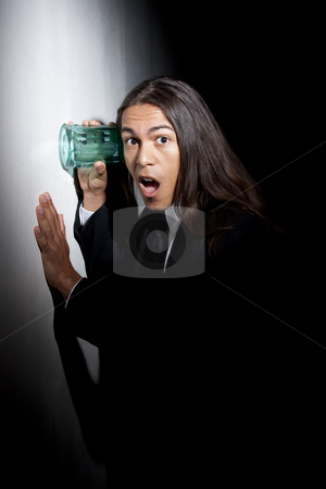 To use this stock image in your creative project, please select the size you need over to the right and click the "Add to Cart" button.
Your downloaded image will come with the Cutcaster watermark removed so don’t worry about the watermark you see on this page. Handsome young mixed race man using glass to eavesdrop stock photo, Handsome young man using glass against wall to eavesdrop by Scott Griessel
