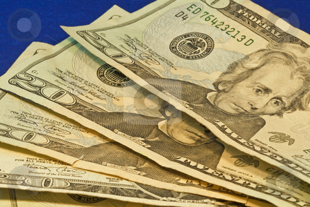 To use this stock image in your creative project, please select the size you need over to the right and click the "Add to Cart" button.
Your downloaded image will come with the Cutcaster watermark removed so don’t worry about the watermark you see on this page. Twenty Dollar Bills stock photo, Stack of twenty dollar bills on blue background by Dennis Crumrin