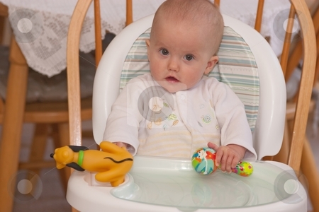 To use this stock image in your creative project, please select the size you need over to the right and click the "Add to Cart" button.
Your downloaded image will come with the Cutcaster watermark removed so don’t worry about the watermark you see on this page. High chair stock photo, A high chair is a piece of furniture used for feeding older babies and younger toddlers. The seat is raised a fair distance from the ground, so that a person of adult height may spoon-feed the child comfortably from a standing position. by Mariusz Jurgielewicz