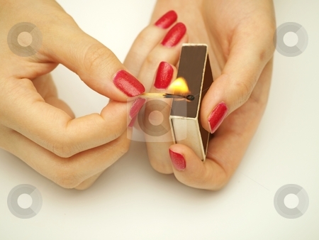 To use this stock image in your creative project, please select the size you need over to the right and click the "Add to Cart" button.
Your downloaded image will come with the Cutcaster watermark removed so don’t worry about the watermark you see on this page. Woman with matchsticks stock photo, A woman holding matchsticks, with fire by Arve Bettum