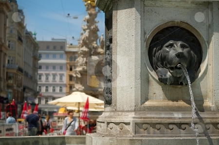 To use this stock image in your creative project, please select the size you need over to the right and click the "Add to Cart" button.
Your downloaded image will come with the Cutcaster watermark removed so don’t worry about the watermark you see on this page. Fountain in a city stock photo, City fountain in summer day with watter spring by Juraj Kovacik