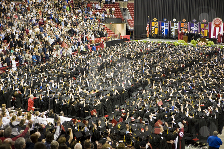 To use this stock image in your creative project, please select the size you need over to the right and click the "Add to Cart" button.
Your downloaded image will come with the Cutcaster watermark removed so don’t worry about the watermark you see on this page. UW Madison Graduation Cheer stock photo, Graduates at the University of Wisconsin, Madison, cheer at the end of their commencement ceremony. by Bart Everett