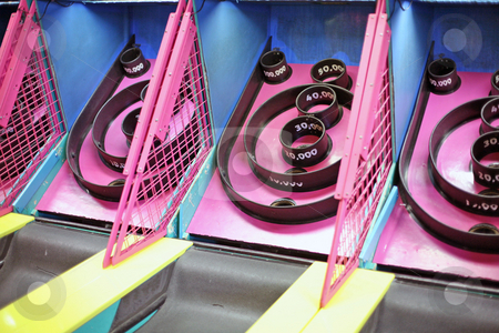 To use this stock image in your creative project, please select the size you need over to the right and click the "Add to Cart" button.
Your downloaded image will come with the Cutcaster watermark removed so don’t worry about the watermark you see on this page. Skee Ball Arcade Game stock photo, Skee Ball Arcade Game by Kim Stanley