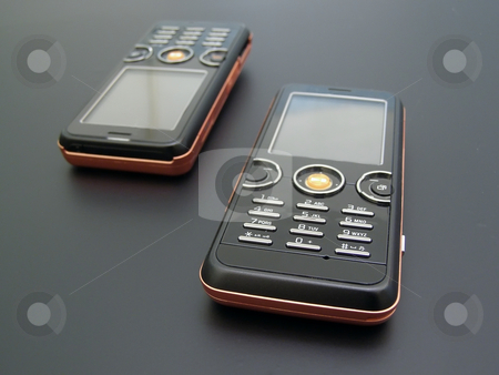 To use this stock image in your creative project, please select the size you need over to the right and click the "Add to Cart" button.
Your downloaded image will come with the Cutcaster watermark removed so don’t worry about the watermark you see on this page. Mobile phones stock photo, Couple of the modern mobile phones by Sergej Razvodovskij