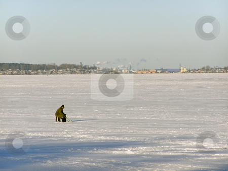 To use this stock image in your creative project, please select the size you need over to the right and click the "Add to Cart" button.
Your downloaded image will come with the Cutcaster watermark removed so don’t worry about the watermark you see on this page. Winter fisherman stock photo, Lonely fisherman on the lake ice far away from town by Sergej Razvodovskij