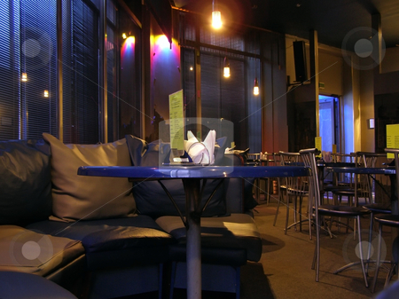 To use this stock image in your creative project, please select the size you need over to the right and click the "Add to Cart" button.
Your downloaded image will come with the Cutcaster watermark removed so don’t worry about the watermark you see on this page. Cafe interior stock photo, Cafe night interior with tables and sofa by Sergej Razvodovskij
