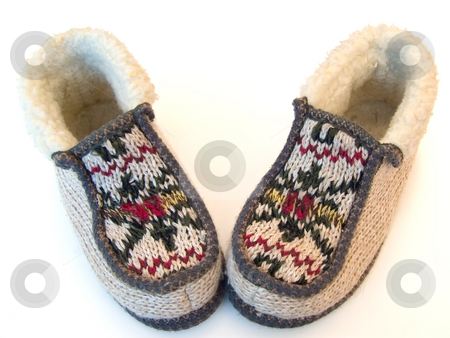 To use this stock image in your creative project, please select the size you need over to the right and click the "Add to Cart" button.
Your downloaded image will come with the Cutcaster watermark removed so don’t worry about the watermark you see on this page. Knitted slippers stock photo, The budge hand made knitted slipperswith ornate by Sergej Razvodovskij