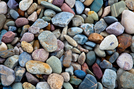 To use this stock image in your creative project, please select the size you need over to the right and click the "Add to Cart" button.
Your downloaded image will come with the Cutcaster watermark removed so don’t worry about the watermark you see on this page. Stones stock photo, Pebbles and stones lying on a beach. A great background. by Norma Cornes