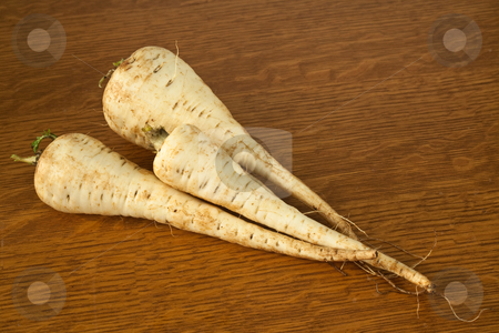 To use this stock image in your creative project, please select the size you need over to the right and click the "Add to Cart" button.
Your downloaded image will come with the Cutcaster watermark removed so don’t worry about the watermark you see on this page. Parsnips stock photo, Three parsnips on a table ready to be prepared for a meal by Norma Cornes