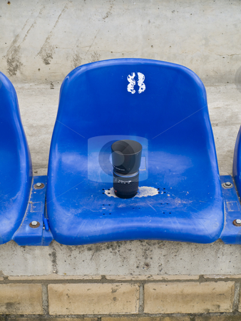 To use this stock image in your creative project, please select the size you need over to the right and click the "Add to Cart" button.
Your downloaded image will come with the Cutcaster watermark removed so don’t worry about the watermark you see on this page. Photo lens at seat stock photo, Single photo lens at the blue stadium seat by Sergej Razvodovskij