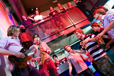 To use this stock image in your creative project, please select the size you need over to the right and click the "Add to Cart" button.
Your downloaded image will come with the Cutcaster watermark removed so don’t worry about the watermark you see on this page. Disco gig stock photo, Musicians on Guitar and Saxophone, accompanied by a DJ, performing in a nightclub by Corepics VOF