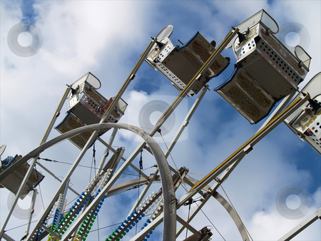 To use this stock image in your creative project, please select the size you need over to the right and click the "Add to Cart" button.
Your downloaded image will come with the Cutcaster watermark removed so don’t worry about the watermark you see on this page. Ferris Wheel stock photo, A ferris wheel at a county fair on a partly cloudy day by Michelle White