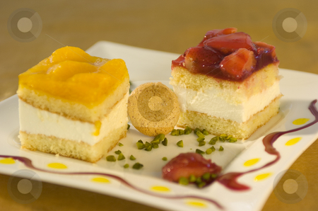 To use this stock image in your creative project, please select the size you need over to the right and click the "Add to Cart" button.
Your downloaded image will come with the Cutcaster watermark removed so don’t worry about the watermark you see on this page. Little cakes stock photo, Little cakes on decorated plate by Andreas Brenner