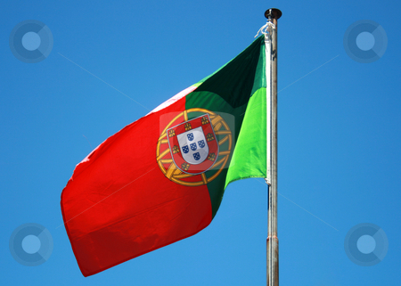 To use this stock image in your creative project, please select the size you need over to the right and click the "Add to Cart" button.
Your downloaded image will come with the Cutcaster watermark removed so don’t worry about the watermark you see on this page. Flag stock photo, Portuguese flag on a blue sky by Marc Torrell