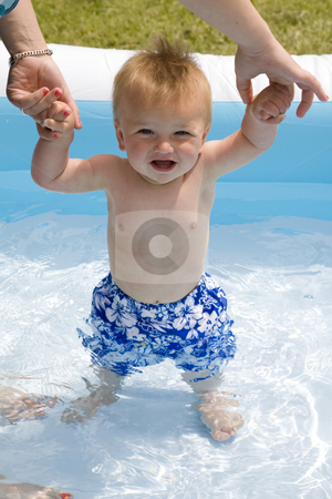 To use this stock image in your creative project, please select the size you need over to the right and click the "Add to Cart" button.
Your downloaded image will come with the Cutcaster watermark removed so don’t worry about the watermark you see on this page. Baby Boy in Pool stock photo, A portrait of a cute nine month old baby boy in a swimming pool. by Travis Manley