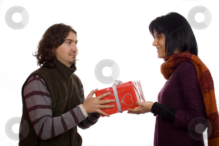 To use this stock image in your creative project, please select the size you need over to the right and click the "Add to Cart" button.
Your downloaded image will come with the Cutcaster watermark removed so don’t worry about the watermark you see on this page. Couple giving a present stock photo, Young man giving a present to a pretty woman by Marc Torrell