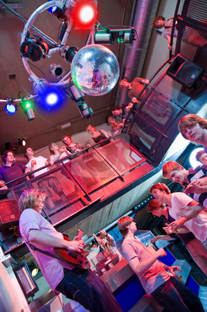 To use this stock image in your creative project, please select the size you need over to the right and click the "Add to Cart" button.
Your downloaded image will come with the Cutcaster watermark removed so don’t worry about the watermark you see on this page. Nightclub stock photo, Crowd of people around a guitar player and saxophonist in a trendy nightclub by Corepics VOF