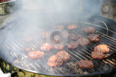 To use this stock image in your creative project, please select the size you need over to the right and click the "Add to Cart" button.
Your downloaded image will come with the Cutcaster watermark removed so don’t worry about the watermark you see on this page. Barbeque Mini Burgers stock photo, Several small hamburgers on the grill over hot charcoal covered with chedder cheese by Lynn Bendickson
