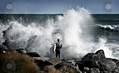 To use this stock image in your creative project, please select the size you need over to the right and click the "Add to Cart" button.
Your downloaded image will come with the Cutcaster watermark removed so don’t worry about the watermark you see on this page. Surfer facing wave stock photo, Surfer facing huge wave waiting for a chance to get into water, Raglan, New Zealand by David Schmidt