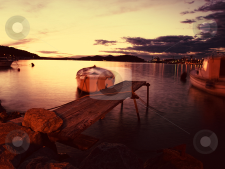 To use this stock image in your creative project, please select the size you need over to the right and click the "Add to Cart" button.
Your downloaded image will come with the Cutcaster watermark removed so don’t worry about the watermark you see on this page. Toned port stock photo, Toned image of sunset in one of Adriatic ports. Background blur shows moving objects on the sea. by Sinisa Botas